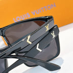 Black sunglasses with gold LV logo on temples and dark lenses