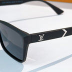 Black square sunglasses frame detail with gold logo on side