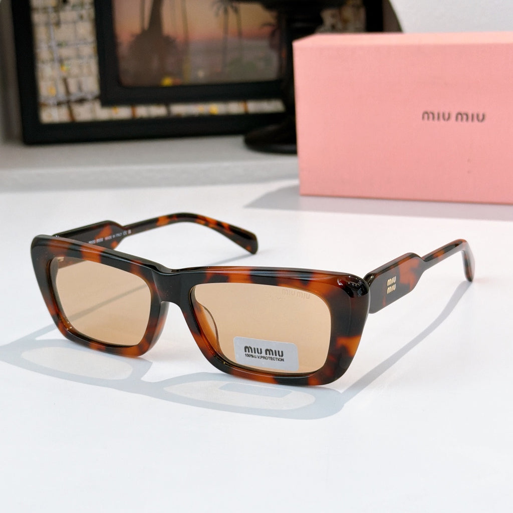 Tortoiseshell rectangular eyeglasses with amber-tinted lenses