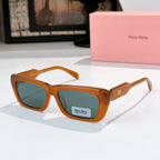 Orange rectangular eyeglasses with teal-tinted lenses