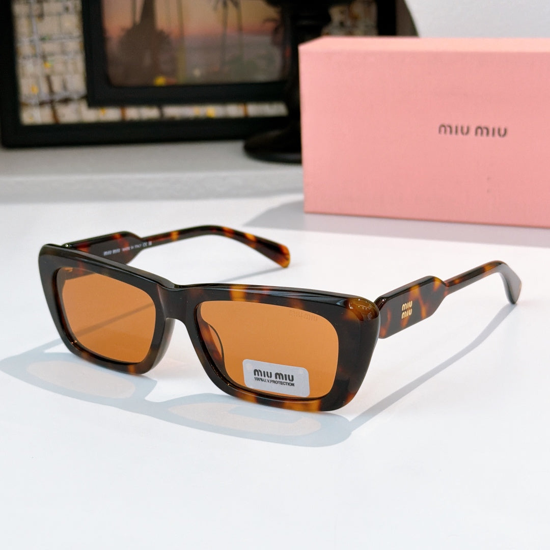Tortoiseshell rectangular eyeglasses with orange-tinted lenses