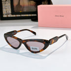 MiuMiu cat-eye glasses with tortoise frame and tinted lenses