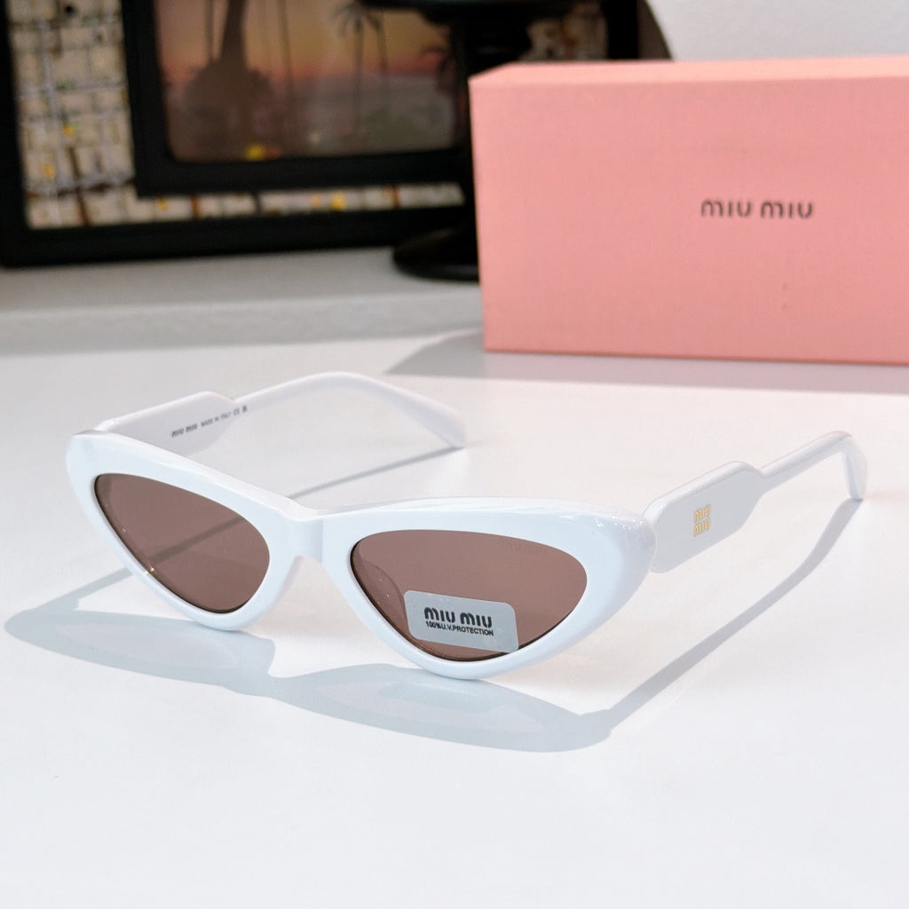 MiuMiu cat-eye glasses with light blue frame and brown tint lenses