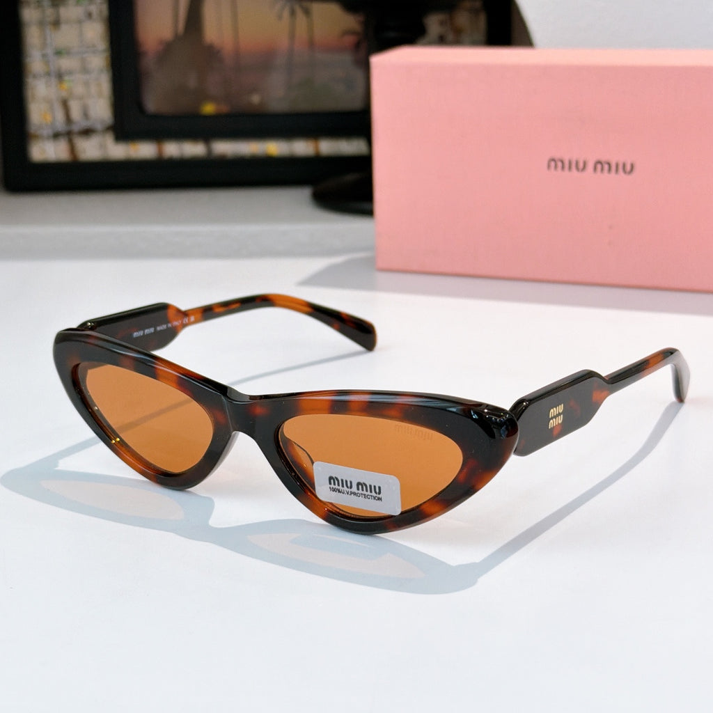 MiuMiu cat-eye glasses with tortoise frame and amber tinted lenses