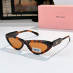 MiuMiu cat-eye glasses with tortoise frame and amber tinted lenses