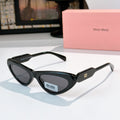 MiuMiu cat-eye glasses with black frame and dark lenses