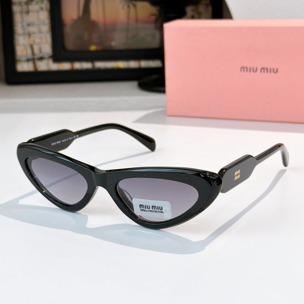 MiuMiu cat-eye glasses with dark frame and pale lenses