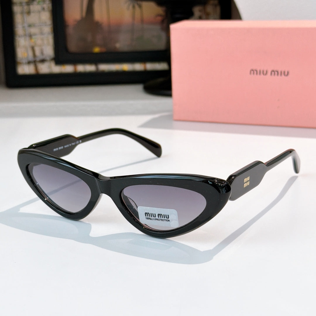 MiuMiu cat-eye glasses with dark frame and pale lenses