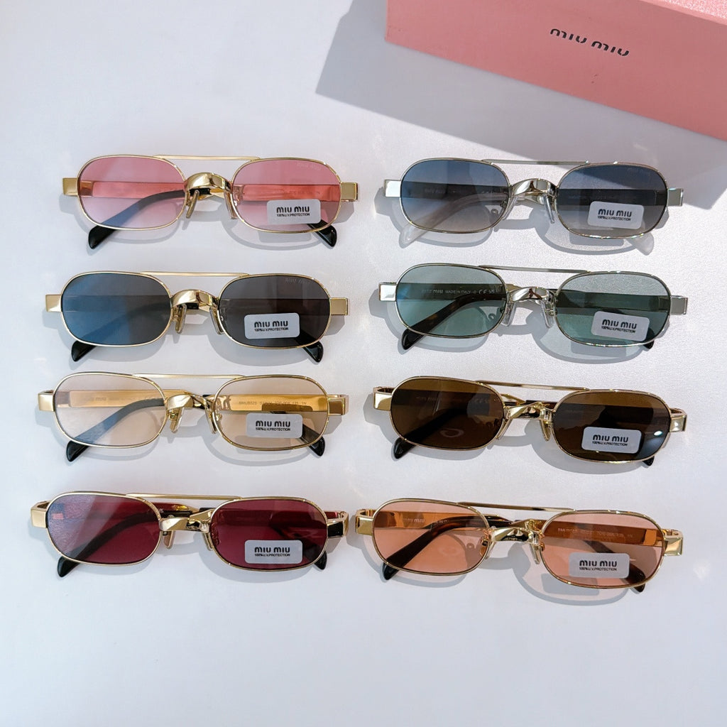 Assorted gold-frame round sunglasses with mixed lens colors on a display