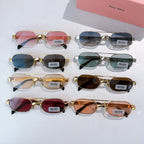 Assorted gold-frame round sunglasses with mixed lens colors on a display