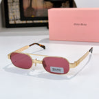 Gold-frame round sunglasses with magenta lenses and tortoise-style temples