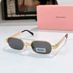 Gold-frame round sunglasses with dark charcoal lenses and tortoise-style temples