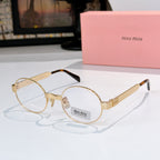 Round sunglasses with gold-tone frame and light pink tinted lenses