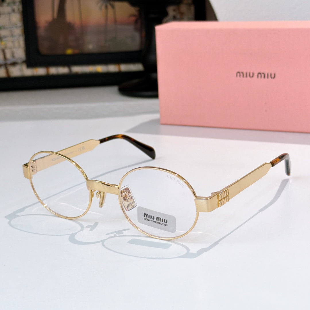 Round sunglasses with gold-tone frame and light pink tinted lenses