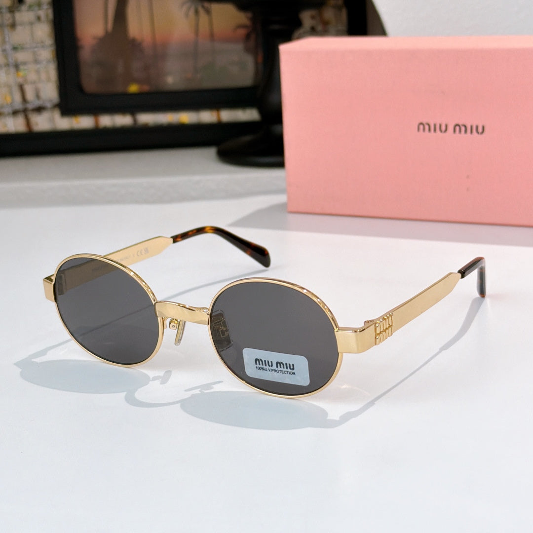 Round sunglasses with gold-tone frame and dark gray tinted lenses