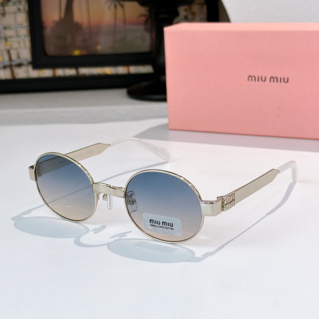 Round sunglasses with gold-tone frame and blue tinted lenses