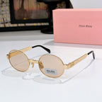 Round sunglasses with gold-tone frame and light beige tinted lenses