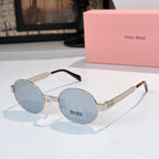 Round sunglasses with gold-tone frame and light blue tinted lenses