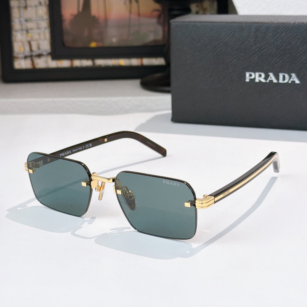 Square sunglasses with dark teal lenses and gold-tone frame