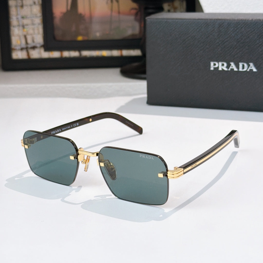 Square sunglasses with dark teal lenses and gold-tone frame