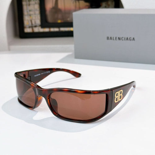 Balenciaga sunglasses with tortoiseshell frame and brown tinted lenses.