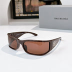 Balenciaga sunglasses with dark brown frame and brown tinted lenses.