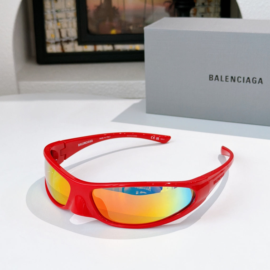 Balenciaga sunglasses with red frames and multicolor gradient lenses, sporty wrap fit.