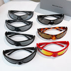 Balenciaga sunglasses assortment with black, tortoiseshell, and red frames and tinted lenses.