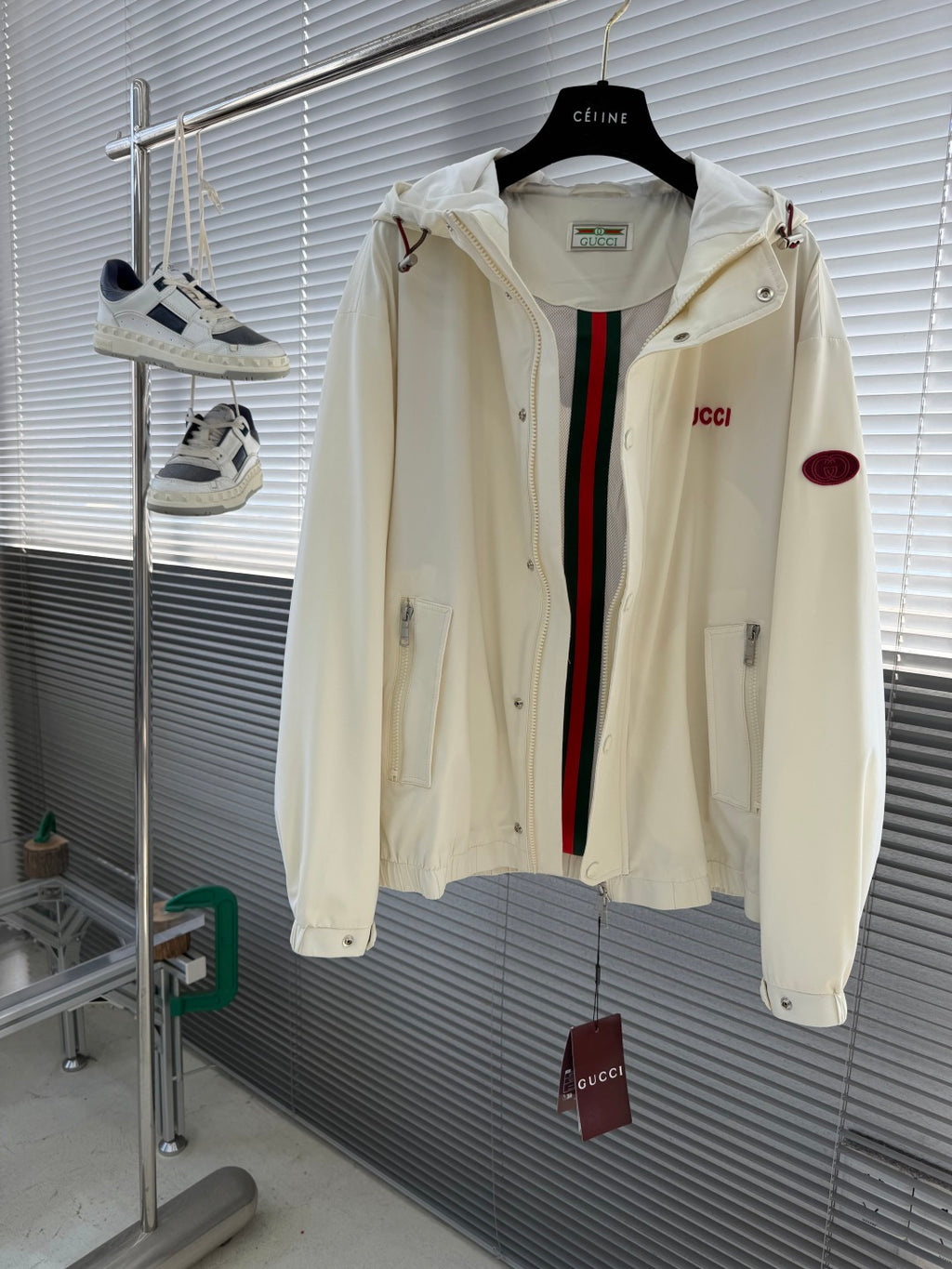 Cream Gucci hooded jacket open front, showing striped inner placket