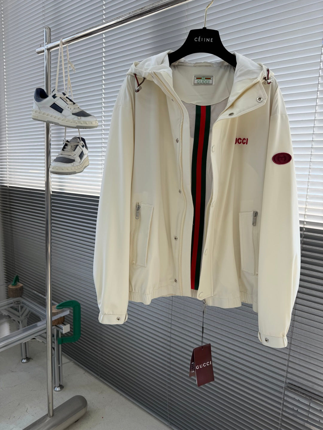 Cream Gucci hooded jacket open front, showing striped inner placket