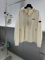 Cream Gucci hooded jacket with front zipper and red Gucci logo