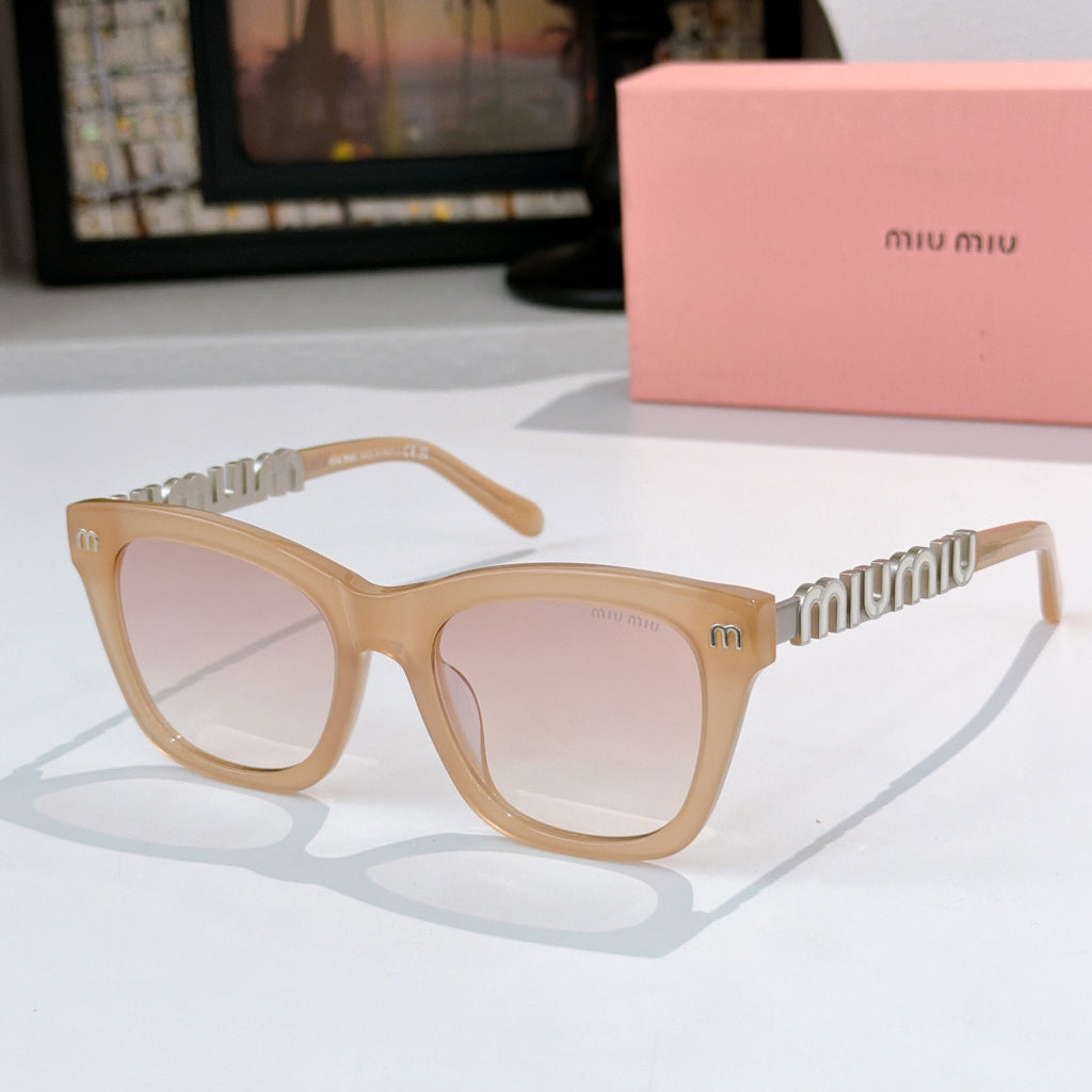 MiuMiu sunglasses with light tan frames, clear lenses, and gold logo on temple arms