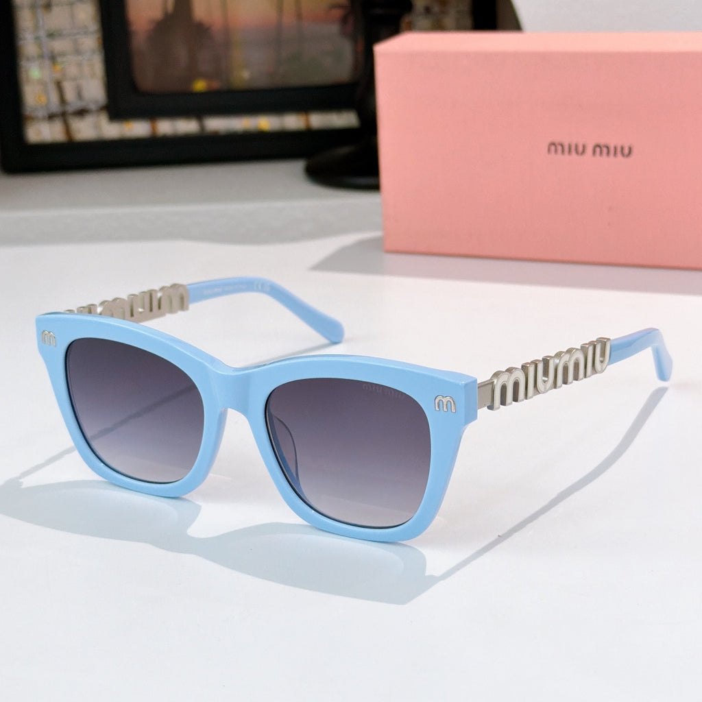 MiuMiu sunglasses with light blue frames, dark lenses, and gold logo on temple arms
