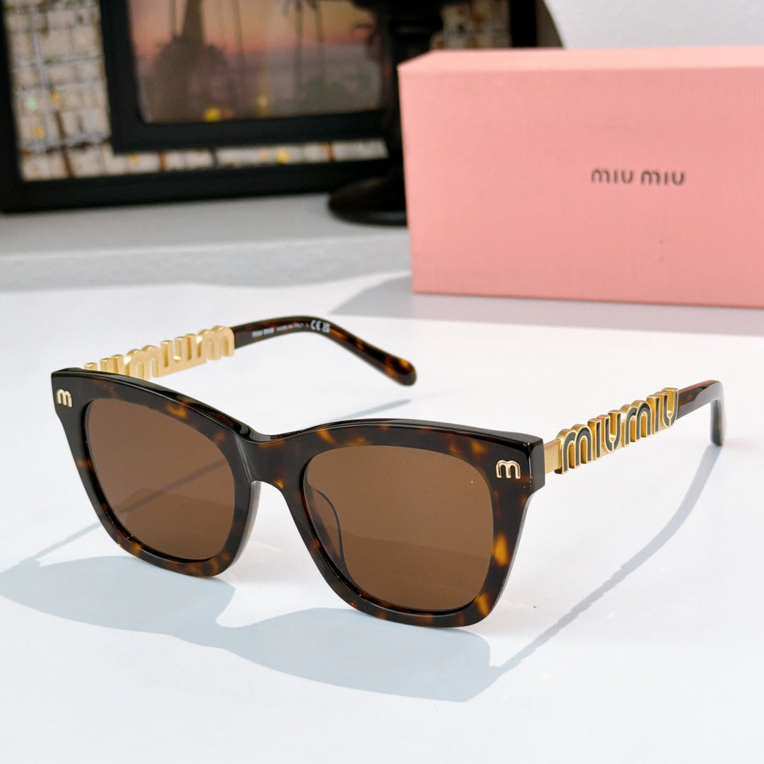 MiuMiu sunglasses with tortoiseshell frames, brown lenses, and gold logo on temples