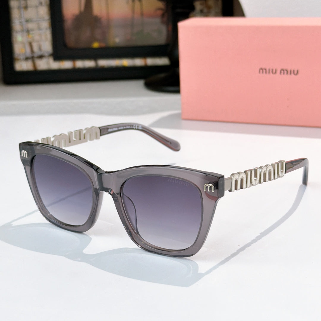 MiuMiu cat-eye sunglasses with dark frames, purple lenses, and gold logo temple detail
