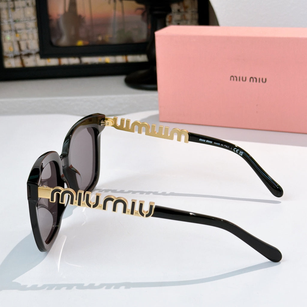 MiuMiu sunglasses with black frame, dark lenses, and gold-accented arms