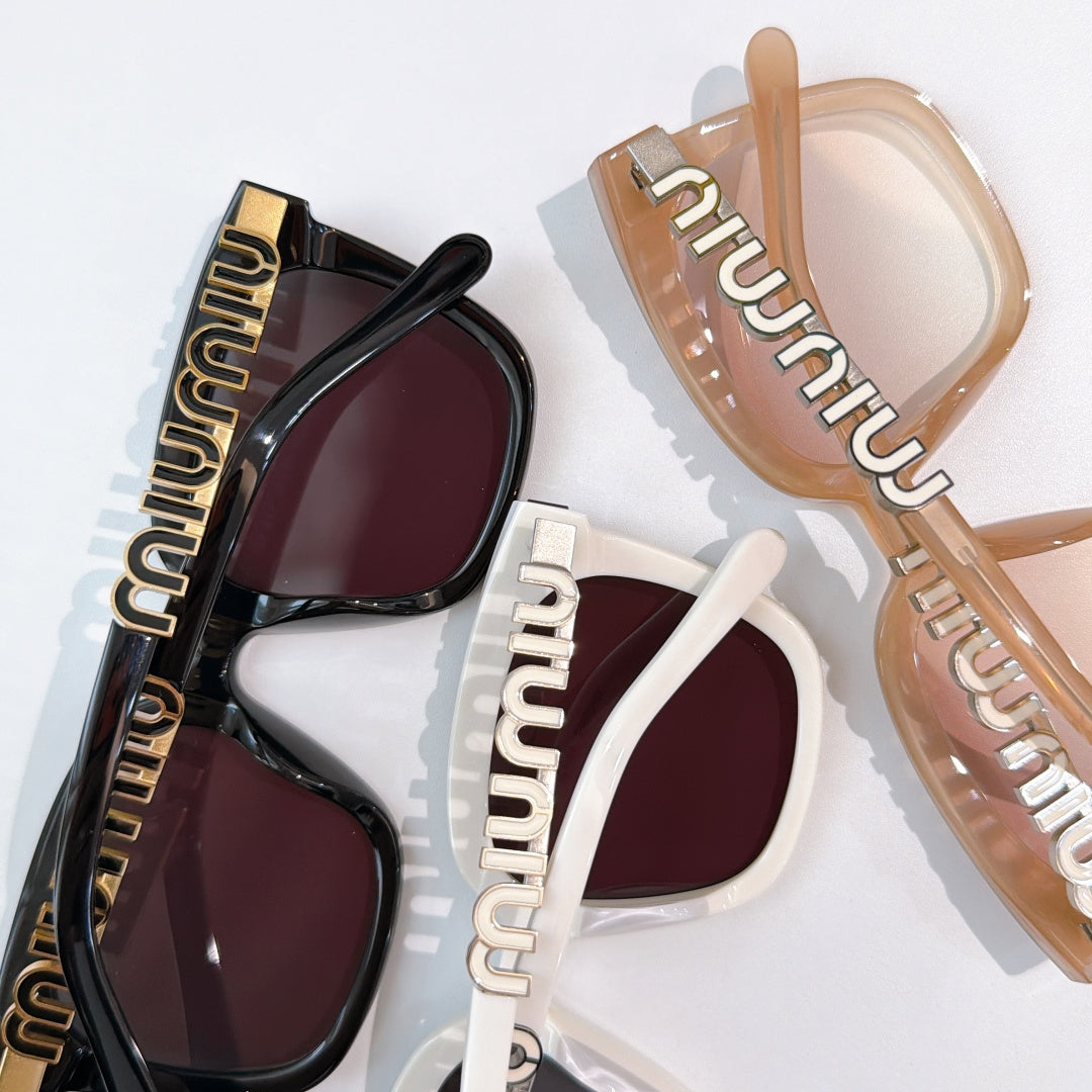 MiuMiu sunglasses with black and tan frames, dark burgundy-tinted lenses