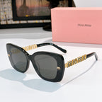 Dark square sunglasses with brown lenses and gold logo temple detail, angled front view