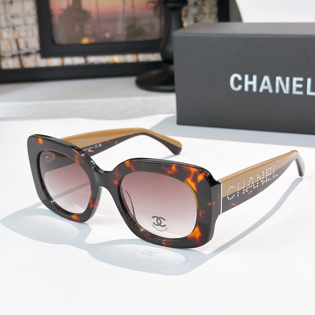 Chanel sunglasses with dark tortoiseshell frames and light pink gradient lenses