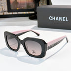 Chanel sunglasses with black frames and light pink gradient lenses, studded logo temple