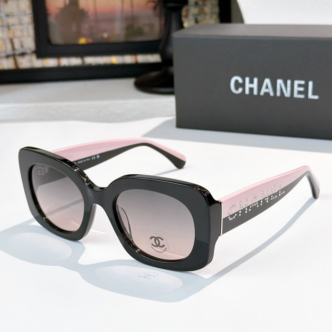 Chanel sunglasses with black frames and light pink gradient lenses, studded logo temple