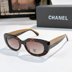 Chanel sunglasses with dark tortoiseshell frames, cream temples, rose tinted lenses and logo