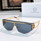 Gold-tone sunglasses with dark blue lenses and circular emblem detail at temple