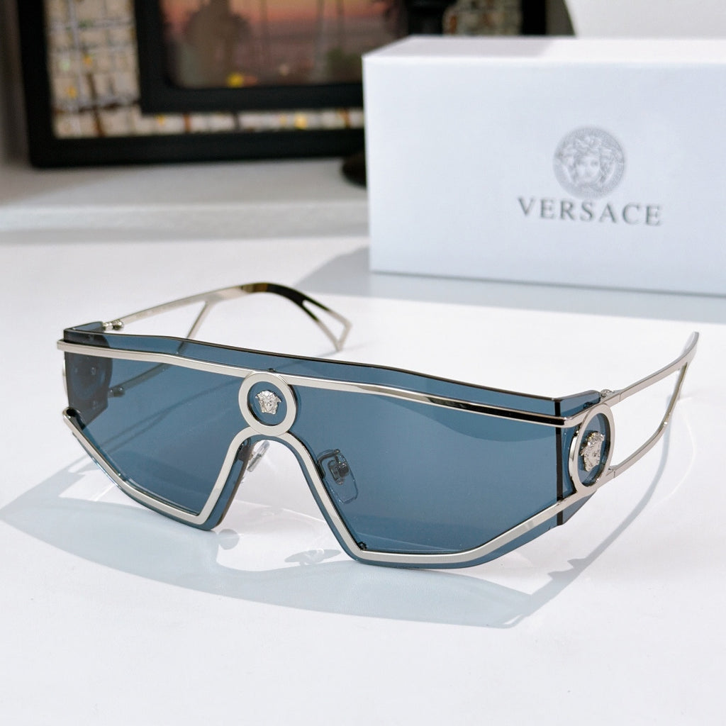 Silver-tone sunglasses with blue tinted lenses and oval logo bridge details