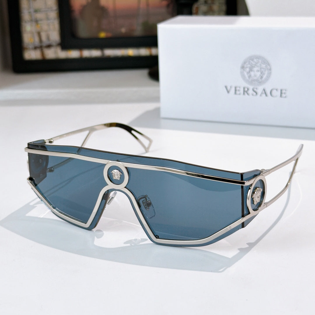 Silver-tone sunglasses with blue tinted lenses and oval logo bridge details