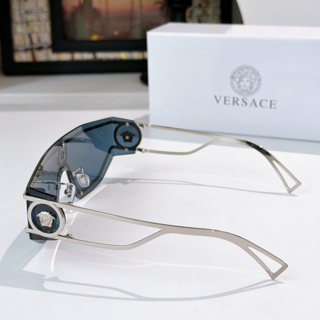 Silver-tone sunglasses with gradient blue-tinted lenses and round logo accents