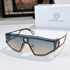 Black-tone oversized sunglasses with blue tinted lenses and oval logo medallions