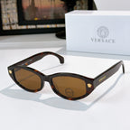Tortoiseshell cat-eye sunglasses with brown lenses and gold emblem temple details