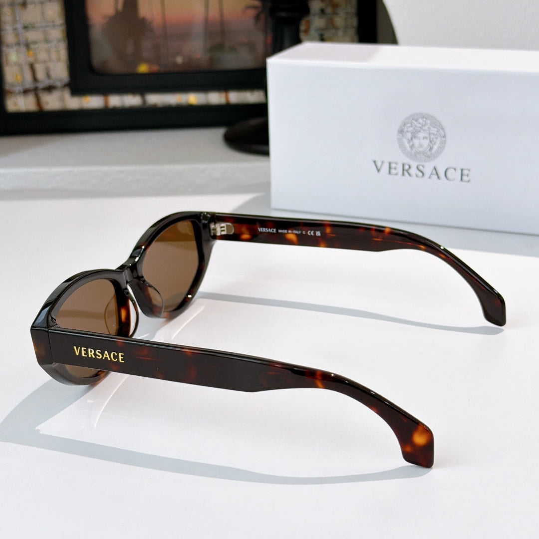 Tortoiseshell rectangular sunglasses with brown lenses and gold emblem on temples
