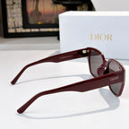 Dior sunglasses side profile with burgundy frames and dark tinted lenses